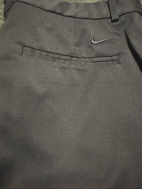 Nike Black Golf Short with Subtle Swoosh Accent. 9 in length